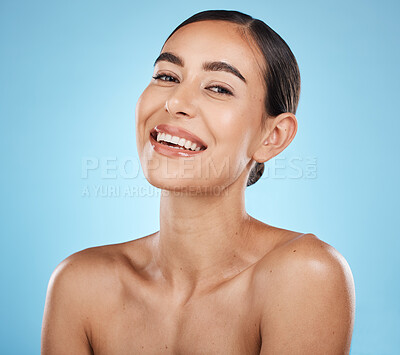 Buy stock photo Portrait, beauty and skin with a model woman in studio on a blue background for natural treatment. Face, skincare and cosmetics with an attractive young female posing to promote a luxury product