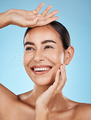 Buy stock photo Woman, face and smile, happiness and beauty with natural cosmetics and glow isolated on blue background. Clean, cosmetic care and hands with facial, makeup and healthy skin with skincare in studio