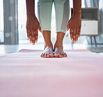 Black woman, hands and feet on yoga mat for stretching, exercise or spiritual workout at home. Hand of African American female in warm up stretch for fitness, training or zen for healthy wellness