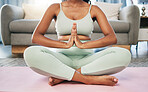 Yoga, meditation and praying hands of woman in zen living room fitness, exercise and mindfulness, healing and peace. Meditate, spiritual and calm person, praying or namaste for self care or wellness