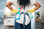 Back, black woman and cleaning for house, products and hygiene for freshness, bacteria and disinfectant. African American female cleaner, lady and maid with cloth, spray bottle and in living room