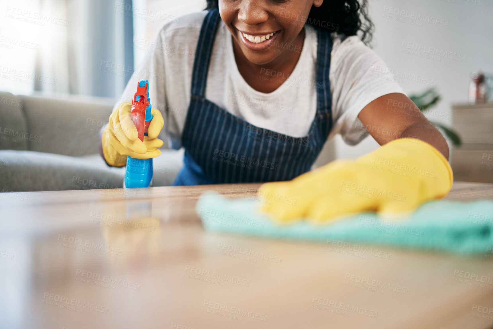 Buy stock photo Hand, cleaning and latex gloves with a black woman using a cloth in a home for hygiene as a housekeeper. Furniture, bacteria and chemical with a female cleaner working in housekeeping in an apartment