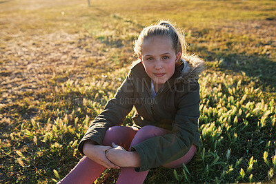 Buy stock photo Nature, portrait and girl on the grass in a park after playing alone on vacation or weekend trip. Natural, beautiful and child having fun and enjoying in outdoor field on holiday in Canada in summer.