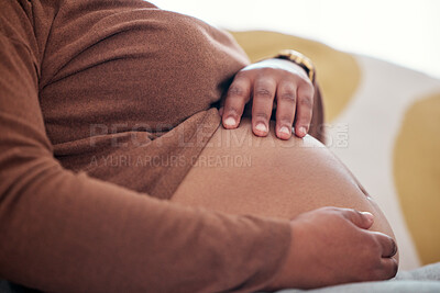 Buy stock photo Pregnancy, maternity and woman touching her belly to play with baby bump in her house. Prenatal, love and pregnant African female holding her stomach for motherhood, maternal love and care at home.