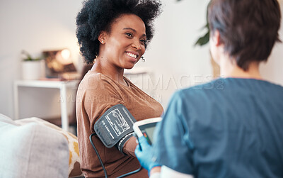 Buy stock photo Black woman, healthcare and checkup with caregiver in bedroom checking, blood pressure or pulse at home. Happy African American female patient or visit from medical nurse monitoring heart in wellness