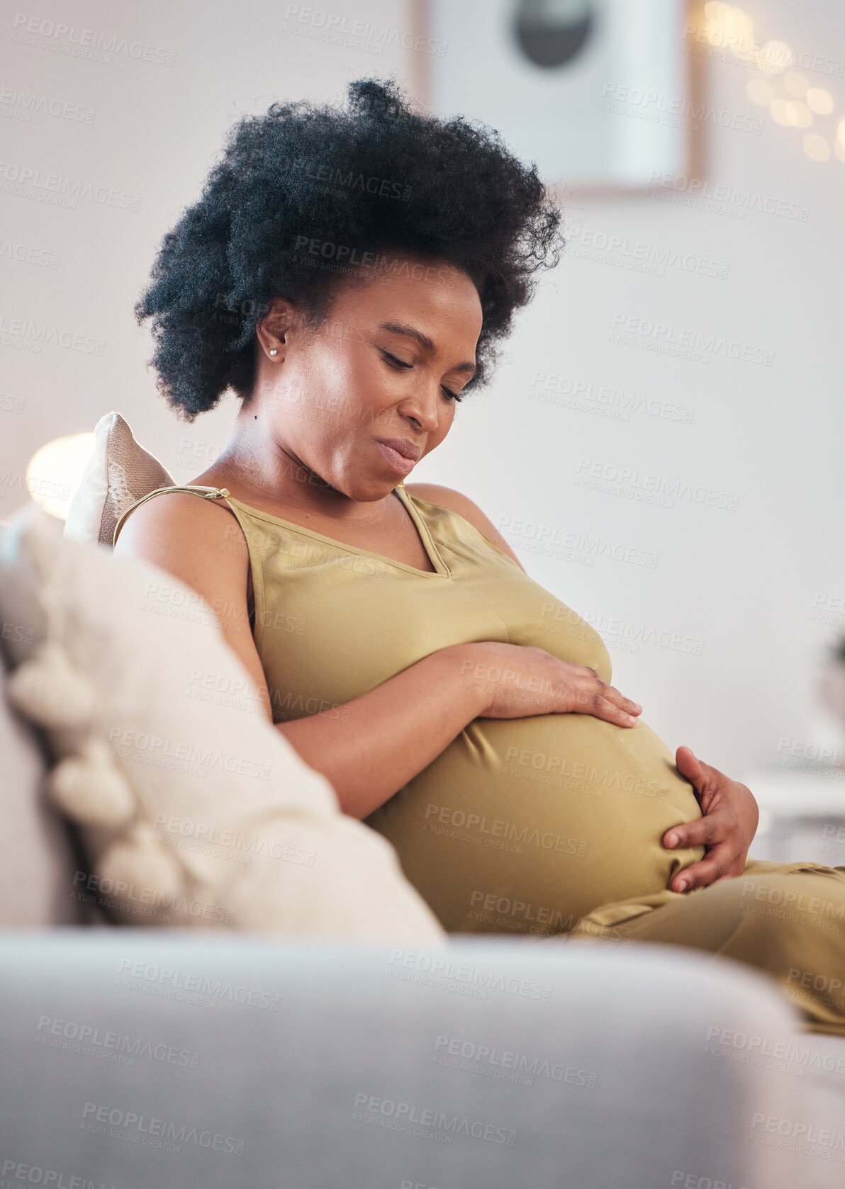 Buy stock photo Pregnant, sofa and black woman hands with hope feeling relax and mother love. Mom care, couch and living room lounge with a person holding abdomen happy about pregnancy lifestyle and baby in a house