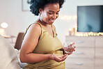 Black woman, glass and smile for pills in pregnancy with smile, nutrition or supplements for self care in house. African pregnant mother, pharma product or medical drink for body healthcare in home