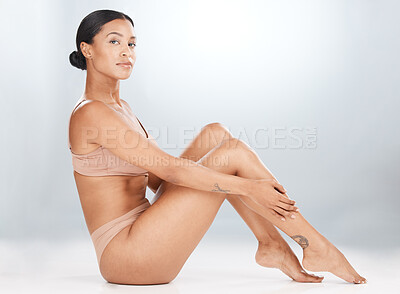 Body, legs and tape measure with a woman in studio on a gray background  measuring for weightloss. F Stock Photo by YuriArcursPeopleimages