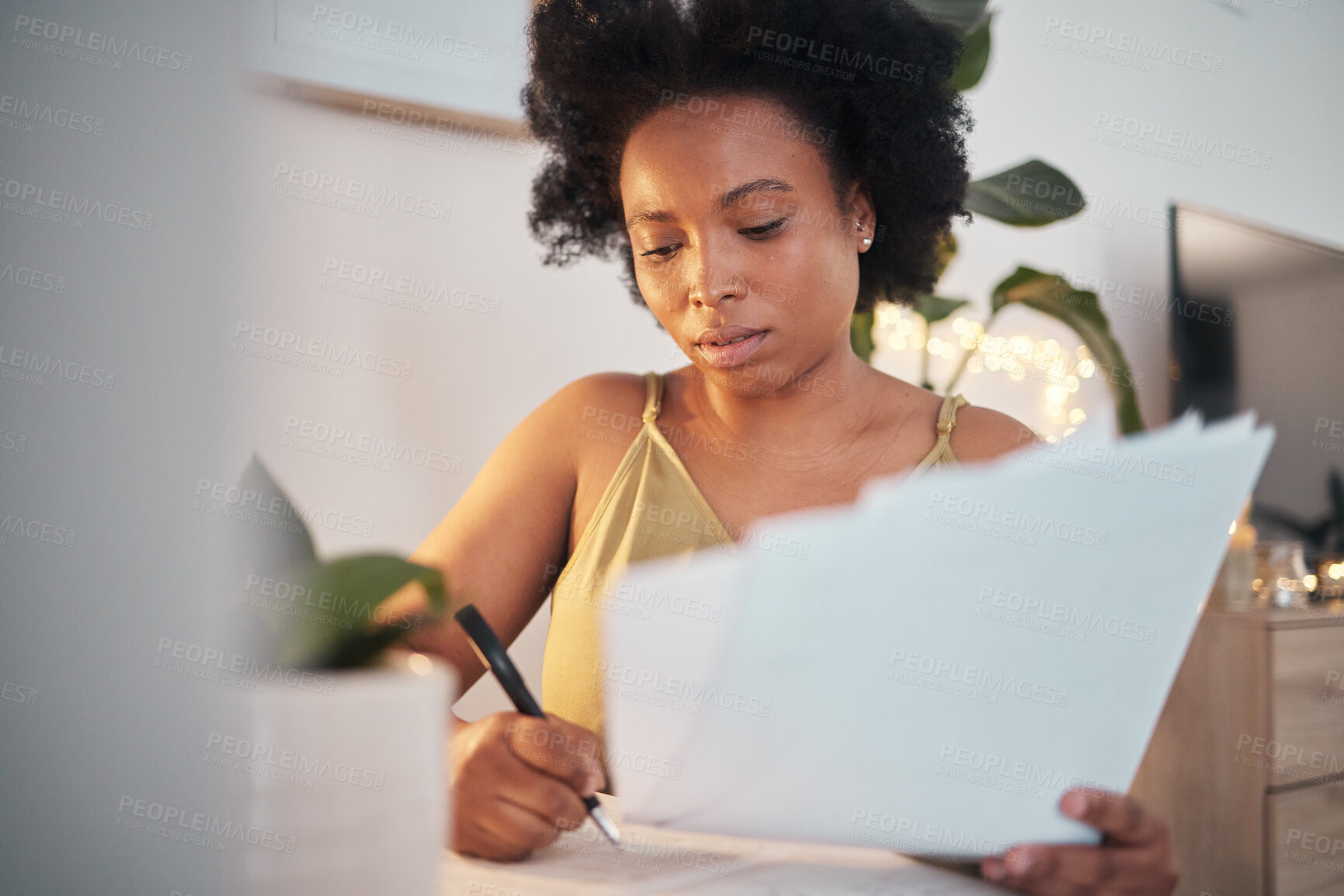 Buy stock photo Bills, paperwork and black woman writing a report, working on tax and home accounting. Finance, loan and African girl with documents for payment, contract and entrepreneurship business investment