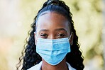 Covid, portrait and doctor at hospital with mask for compliance, safety and healthcare on bokeh background. Face, corona and female health expert at a clinic for help, goal and innovation outside