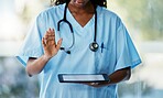 Healthcare, tablet and doctor with stethoscope in hospital checking results after a consultation. Medical, technology and African female nurse with a mobile device for research in a medicare clinic.