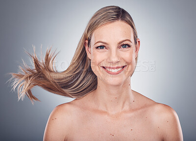 Buy stock photo Woman in portrait, happy and face with hair in air, beauty and keratin treatment, cosmetic care isolated on studio background. Model smile, glow and hairstyle shine, natural cosmetics and skincare