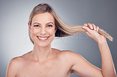 Buy stock photo Hair care, health and portrait of a woman in a studio with a keratin, botox and brazilian hair treatment. Happy, wellness and female model with a long, healthy and shiny hair style by gray background