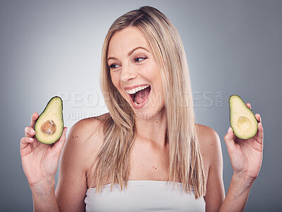 Buy stock photo Beauty, avocado and skin or hair care of a woman in studio with natural cosmetics and shampoo for shine. Face of aesthetic model excited on a grey background for hairdresser or sustainable product