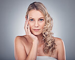 Woman, face and hair with portrait and hand, hairstyle and balayage with keratin treatment isolated on studio background. Beauty, skincare and natural cosmetics with wellness and healthy skin