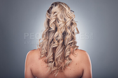 Buy stock photo Hair care, beauty and woman with curly hairstyle texture after salon treatment in a studio. Gray background, isolated and model with hairdresser balayage, dye and growth from haircut and keratin