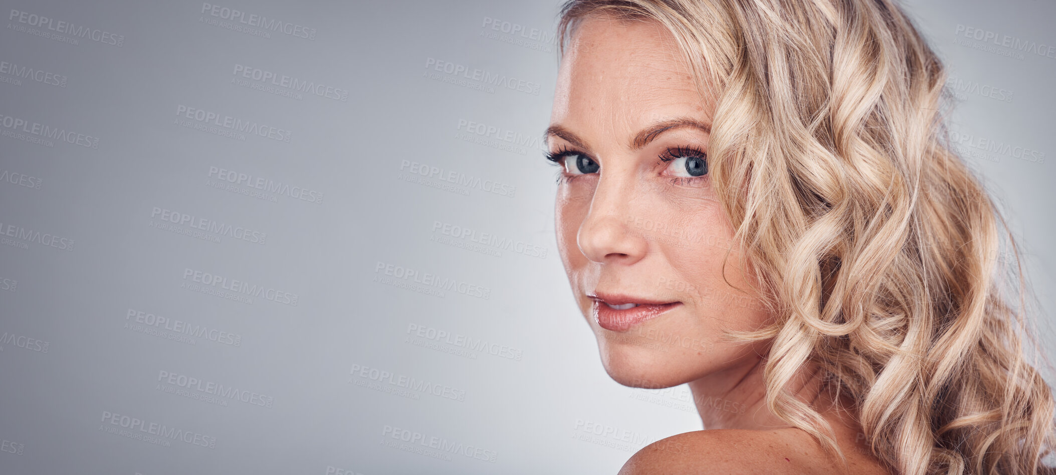 Buy stock photo Woman, beauty and portrait smile on mockup for skincare, cosmetics or makeup against a gray studio background. Happy attractive blond female face smiling in satisfaction for facial spa treatment