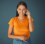 Woman, happy portrait and listening to music online while streaming on a studio background. Smile of a young gen z person with wireless earphones for funny podcast, radio or audio to relax on blue