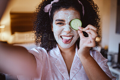 Buy stock photo Selfie, portrait and cucumber for skincare by woman, happy and emoji, fun and silly while grooming, mask or facial. Face, fruit and girl with tongue out for photo, beauty or routine with eco product