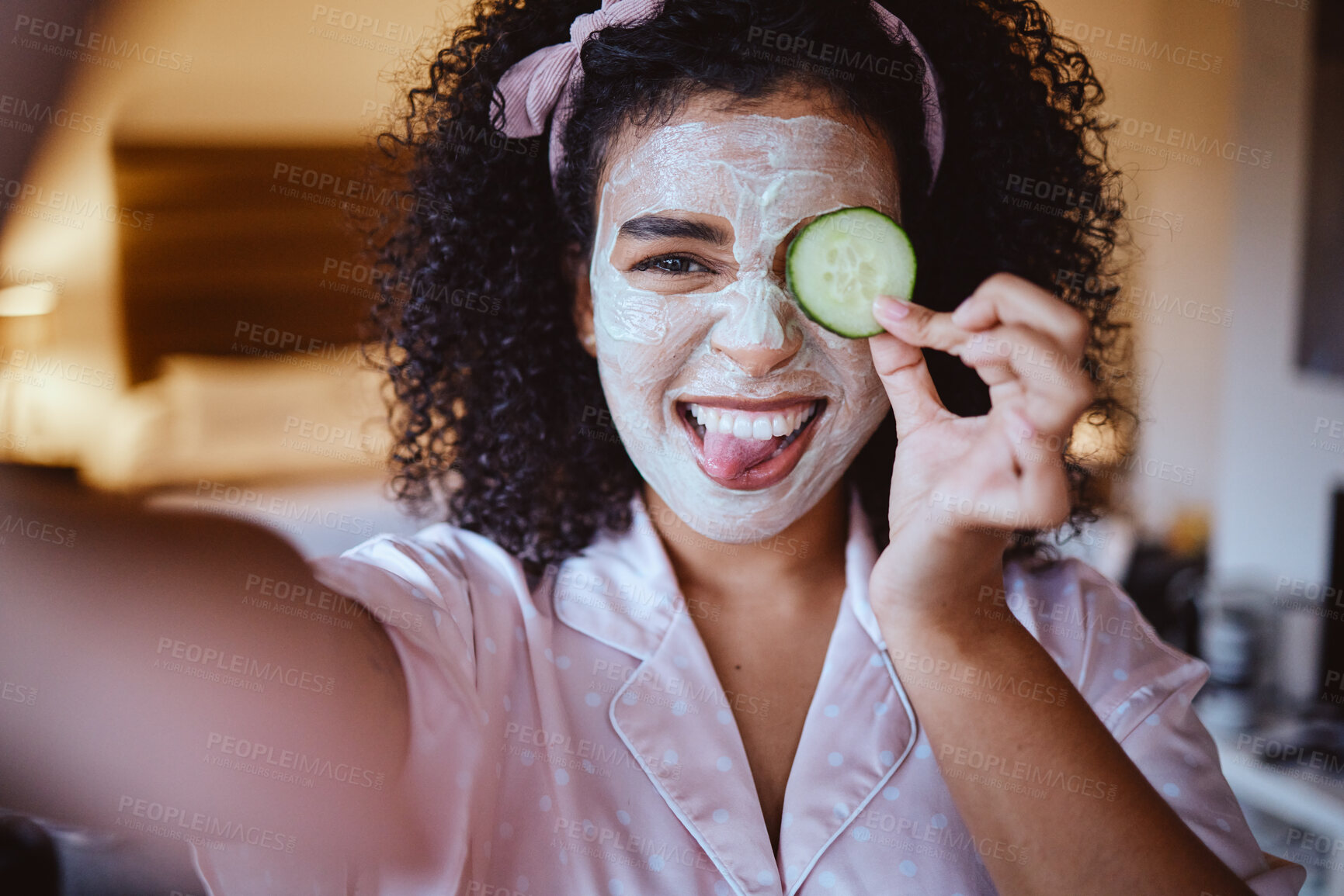 Buy stock photo Selfie, portrait and cucumber for skincare by woman, happy and emoji, fun and silly while grooming, mask or facial. Face, fruit and girl with tongue out for photo, beauty or routine with eco product