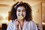 Orange, skincare and portrait of woman eating in bedroom for wellness, grooming or facial. Fruit, face and girl relax with citrus product, natural and skin, detox and diet, happy and smile in bedroom