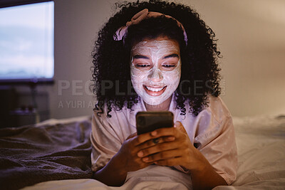 Buy stock photo Black woman, afro or skincare mask and phone in house bedroom, home or hotel on social media app or web. Smile, happy or facial product on relax person on mobile technology for face grooming research