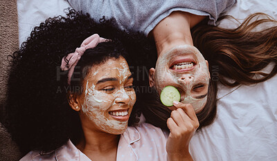 Buy stock photo Facial, cucumber or beauty with girl best friends lying on the floor together for treatment at a sleepover. Face mask, skincare or natural care with a female and friend at home to relax while bonding