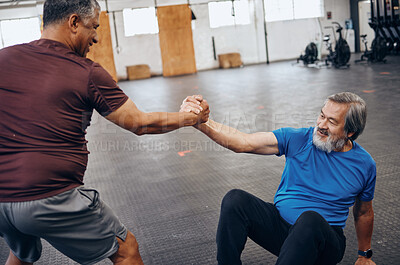 Buy stock photo Teamwork, support and helping hands of friends in gym after workout, exercise and training. Sports, get up and senior men help, collaboration and team work while exercising for health and wellness.