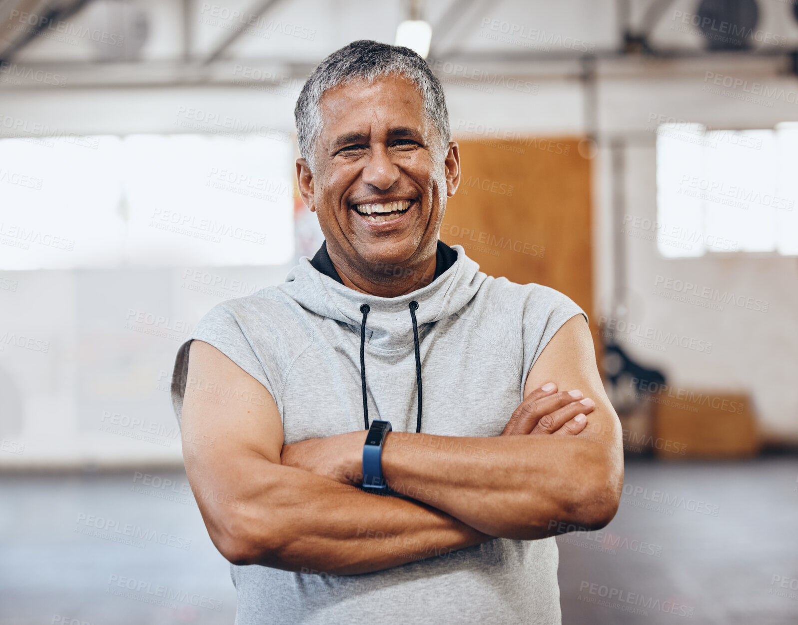 Buy stock photo Gym, fitness and portrait of old man with smile and crossed arms for motivation, wellness and cardio workout. Muscles, healthy body and face of senior male after training, exercise and sports goals