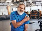 Sports, gym and shoulder injury, old man in pain and emergency during workout at fitness studio. Health, wellness and inflammation, senior person with hand on muscle cramps while training in Japan.