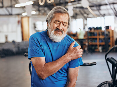 Buy stock photo Sports, gym and shoulder injury, old man in pain and emergency during workout at fitness studio. Health, wellness and inflammation, senior person with hand on muscle cramps while training in Japan.