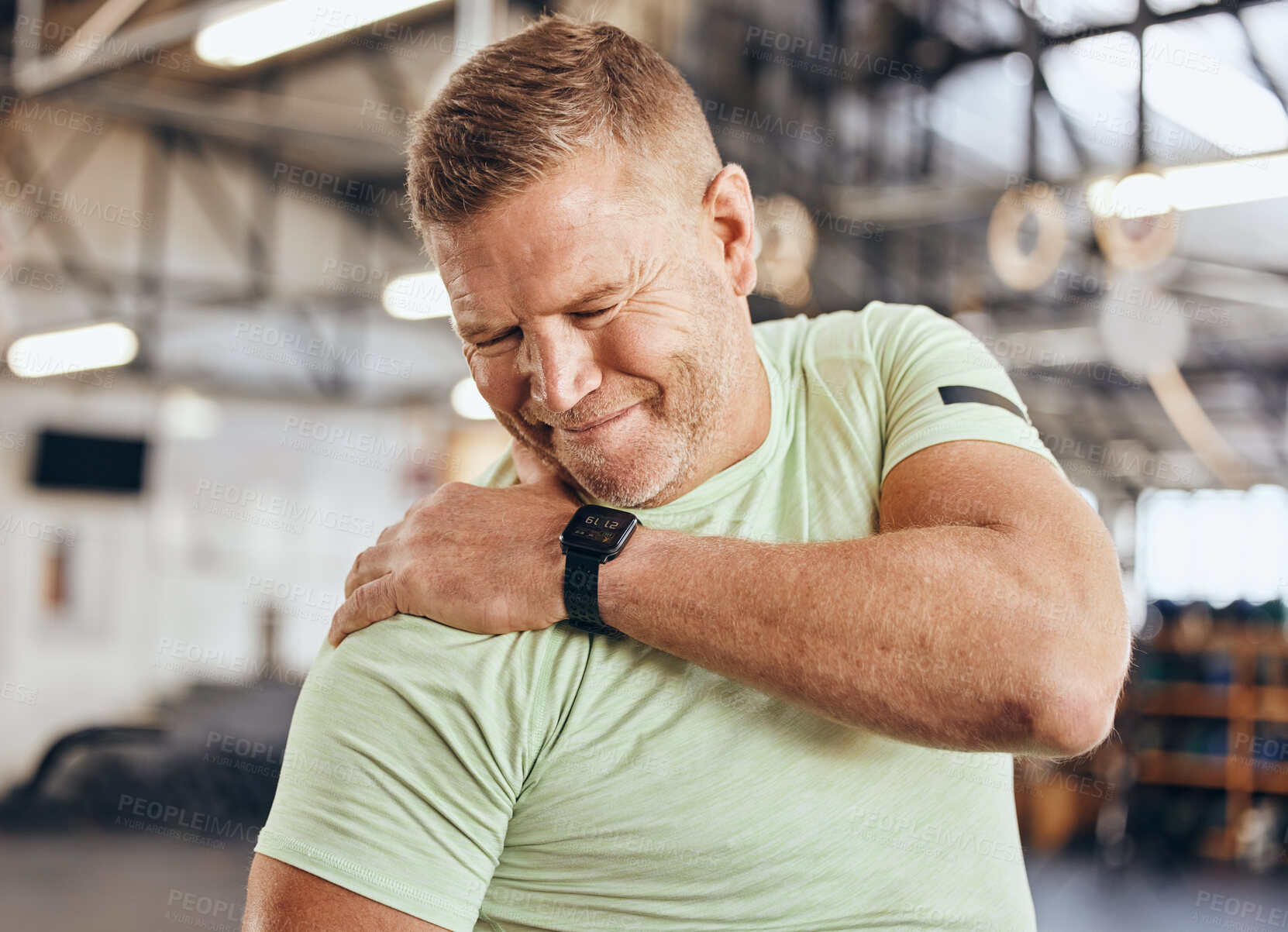 Buy stock photo Shoulder pain, fitness and bodybuilder man in gym for training, workout and challenge exercise with medical risk. Injury, muscle and strong person or athlete with sports burnout, arm or arthritis 