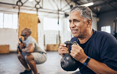 Buy stock photo Training, senior and man exercise with personal trainer at the gym squat with kettlebell equipment for strength. Elderly, old and fitness people workout in a health club for wellness and motivation