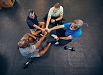 Team, fitness and teamwork by senior men exercise, workout and training together at the gym. Group, collaboration and hands in a huddle for diversity, support and trust together by elderly people
