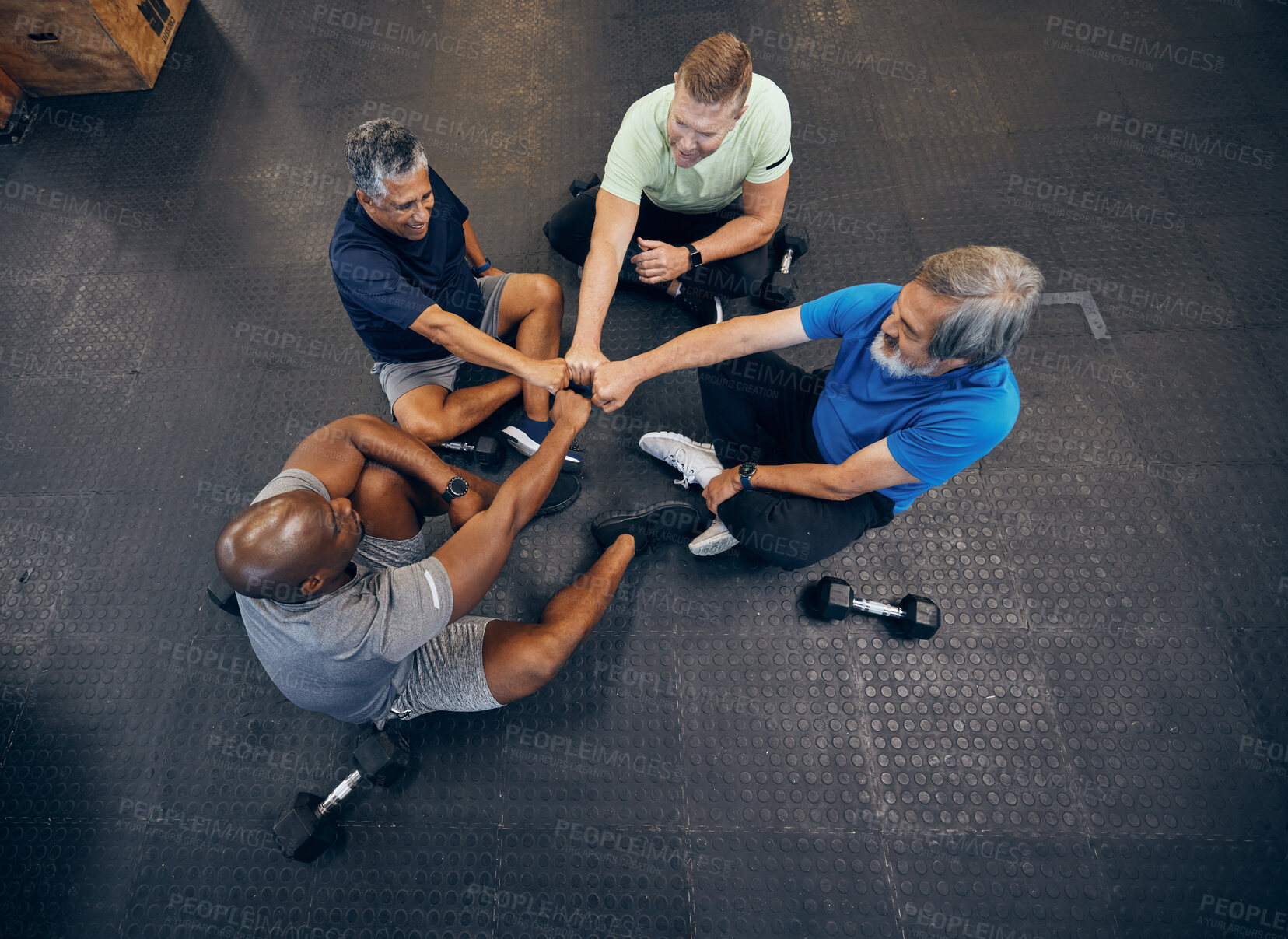 Buy stock photo Team, fitness and teamwork by senior men exercise, workout and training together at the gym. Group, collaboration and hands in a huddle for diversity, support and trust together by elderly people