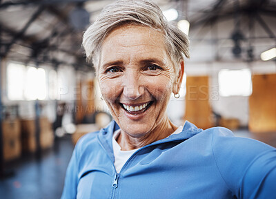 Buy stock photo Selfie, smile and fitness senior woman taking picture in the gym after exercise, workout or training having fun. Elderly, old and portrait of fit female happy for wellness and health on social media
