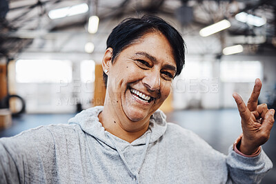 Buy stock photo Gym, fitness and selfie of old woman with peace sign, smile and motivation for exercise in Brazil. Workout, happy training and mature lady in profile picture for social media with emoji hand gesture.