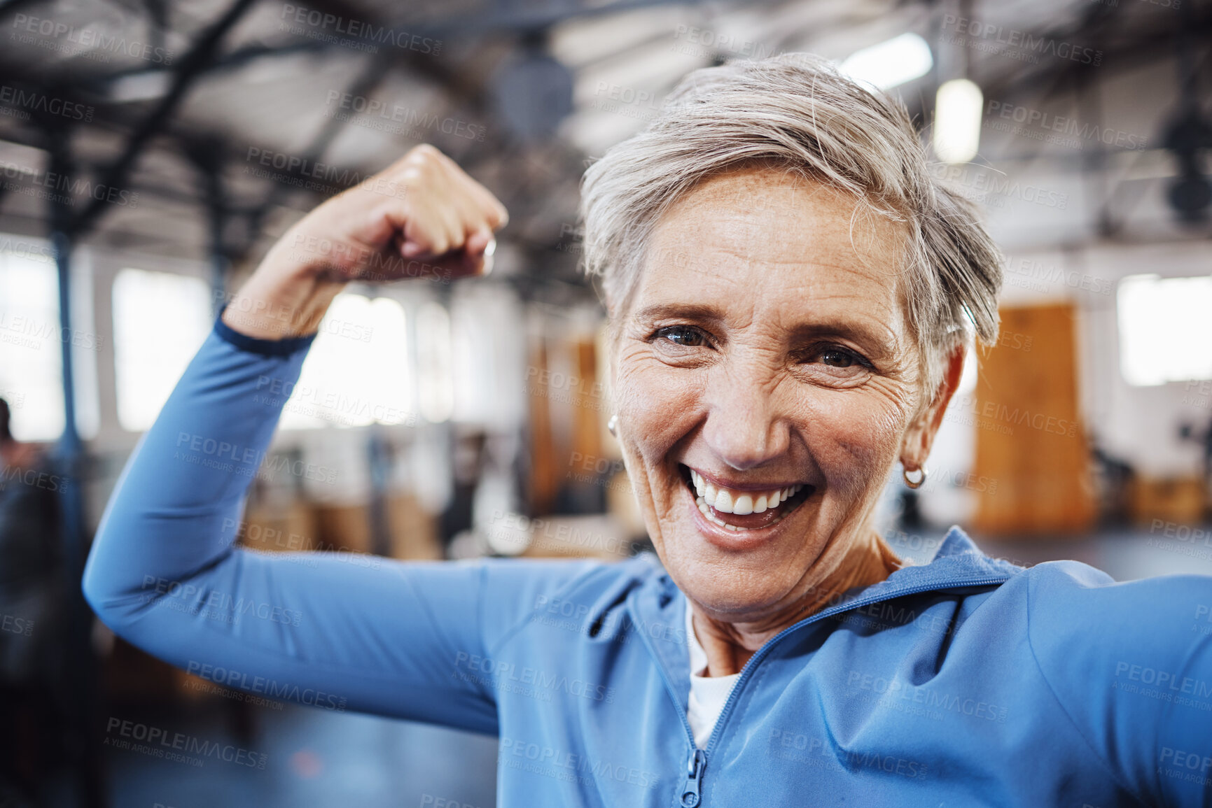 Buy stock photo Senior woman, flexing and smile for selfie or profile picture in exercise, workout or muscle training at the gym. Portrait of happy elderly female in fitness smiling for vlog, social media or post