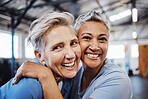 Mature women, portrait or hug in workout, gym or training healthcare wellness, bonding activity or exercise class. Smile, happy and retirement fitness friends in teamwork goals or community support