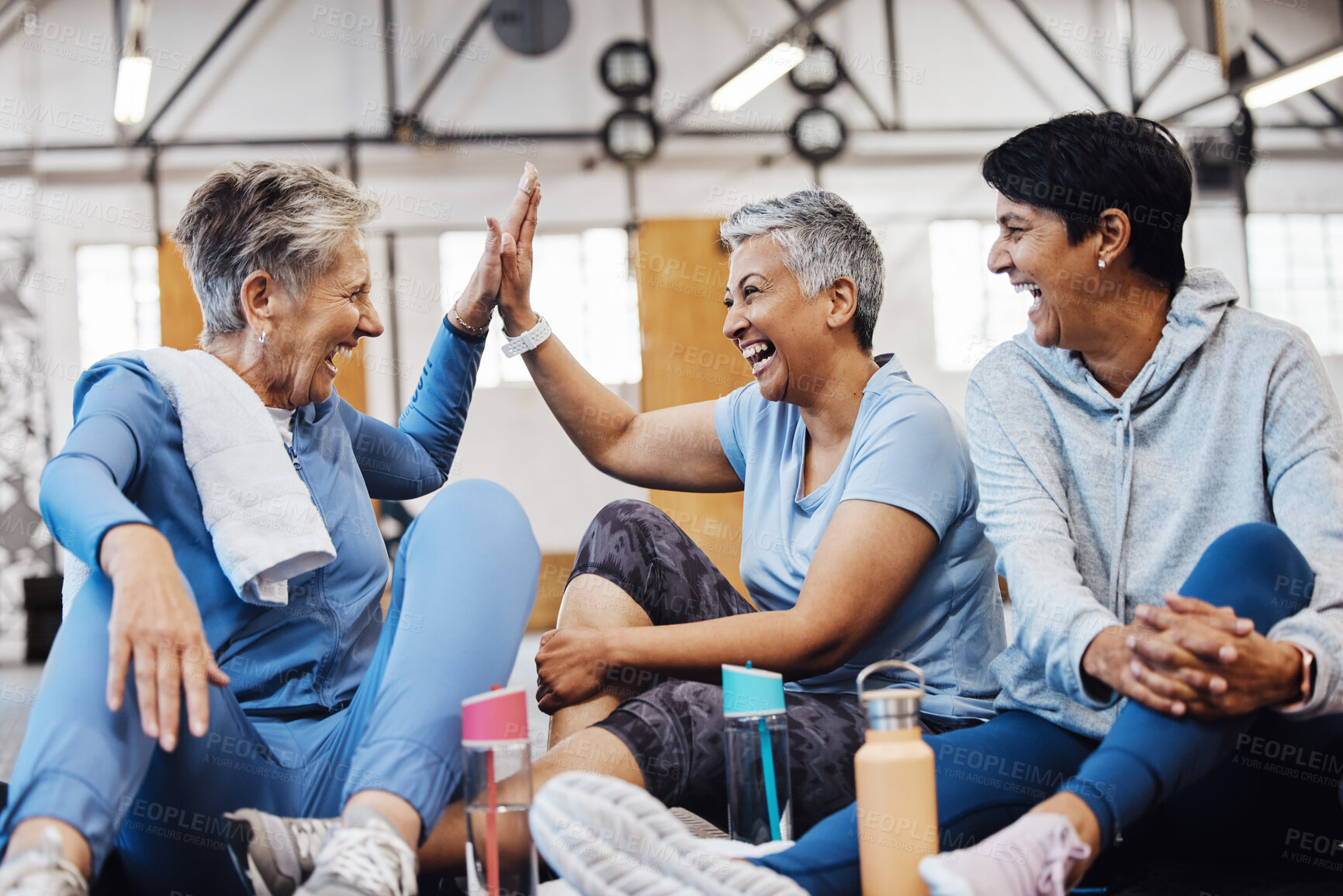 Buy stock photo Gym, high five and group of mature women celebrate after fitness class, conversation and congratulations on floor. Exercise, bonding and happy senior woman with friends sitting together at workout.