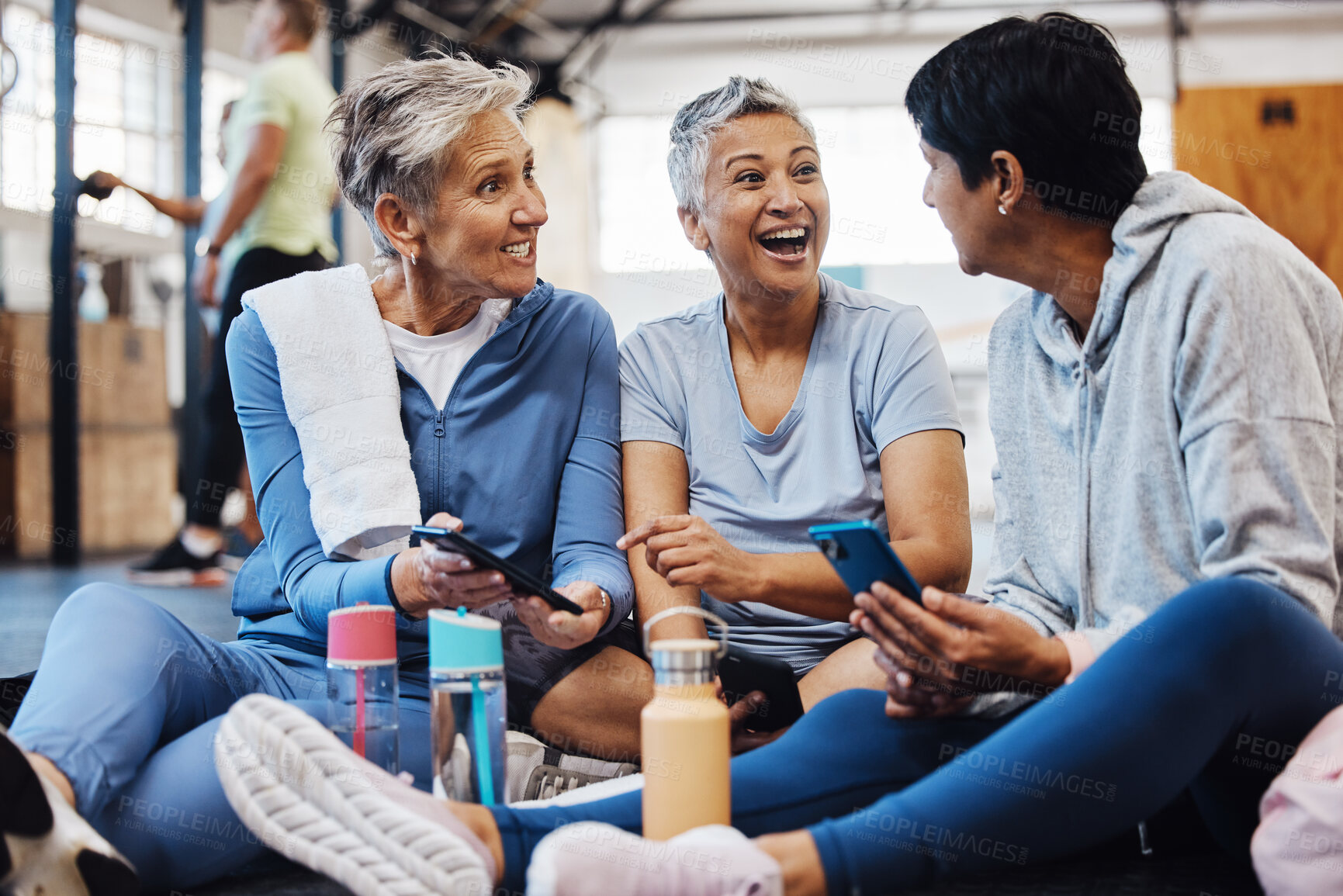 Buy stock photo Fitness, gossip and senior friends with phone laughing at meme after yoga class, conversation and comedy on floor. Exercise, bonding and happy mature women checking social media together at workout.
