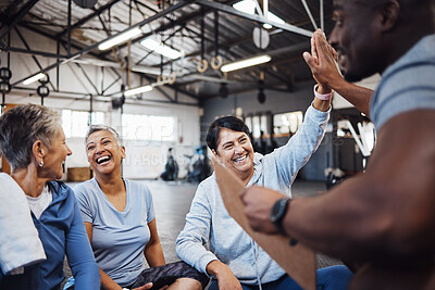 Buy stock photo High five, group or team of fitness senior women at the gym after exercise, workout or training with personal trainer. Elderly, old and people happy, smile and excited for teamwork and motivation