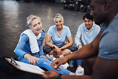 Buy stock photo Senior woman, talking and personal trainer contract with elderly friends ready for wellness. Sports checklist, gym document and workout group with happiness in a training gym floor for fitness 