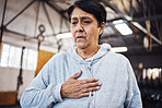 Senior woman with chest pain or injury in the gym after a intense workout or training. Healthcare, sick and elderly lady in retirement with asthma or breathing problem during exercise in sport center