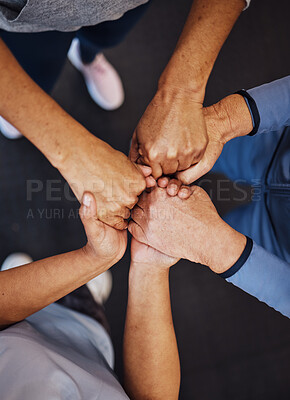 Buy stock photo Hands, teamwork and fitness with sports people standing in a huddle at gym from above for health. Collaboration, support and motivation with a man and woman athlete group in a circle for exercise