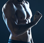 Fitness, body and man flexing arm on blue background, isolated, neon blue light and muscular chest. Sports, muscle and topless male model in artistic dark studio for power workout and gym aesthetic.