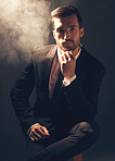 Portrait, smoke and man in suit, fashion and stylish guy against dark studio background. Face, male leader and gentleman with confidence, manager and leader for business, elegant outfit and executive