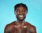 Shower, portrait and black man isolated on blue background with water drops for face cleaning, body and skincare glow. Strong, beauty and happy model or person in studio headshot washing for hygiene