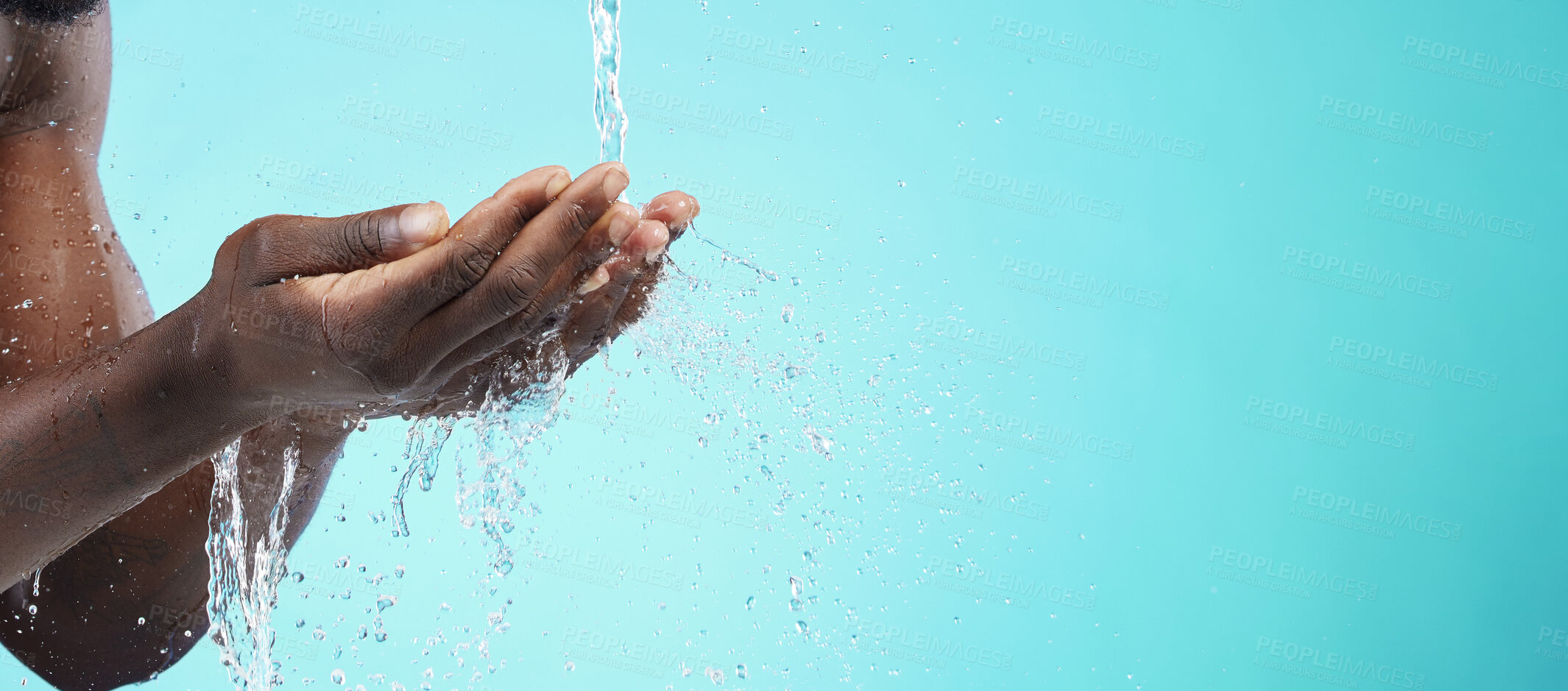 Buy stock photo Water, black man and cleaning hands with mockup space, wash face and skincare isolated on blue background. Healthy skin, clean cosmetics and grooming, hygiene and beauty sustainability in studio