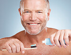 Portrait, toothpaste or old man brushing teeth with dental products in a healthy oral hygiene grooming in studio. Face, smile or happy senior guy cleaning mouth with a natural bamboo wood toothbrush 